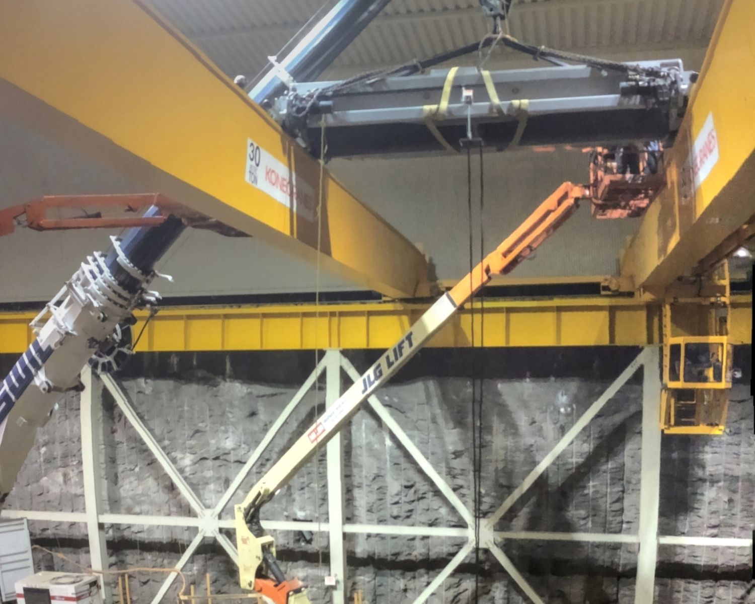 Crane lifting a component over the unit pit