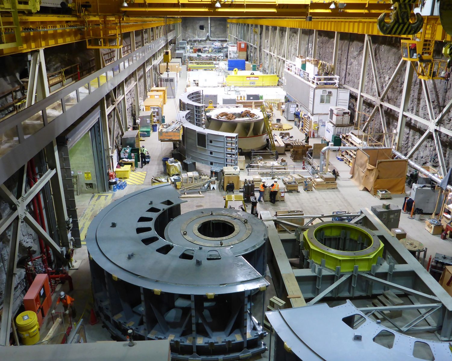 Generator components staged on the powerhouse floor