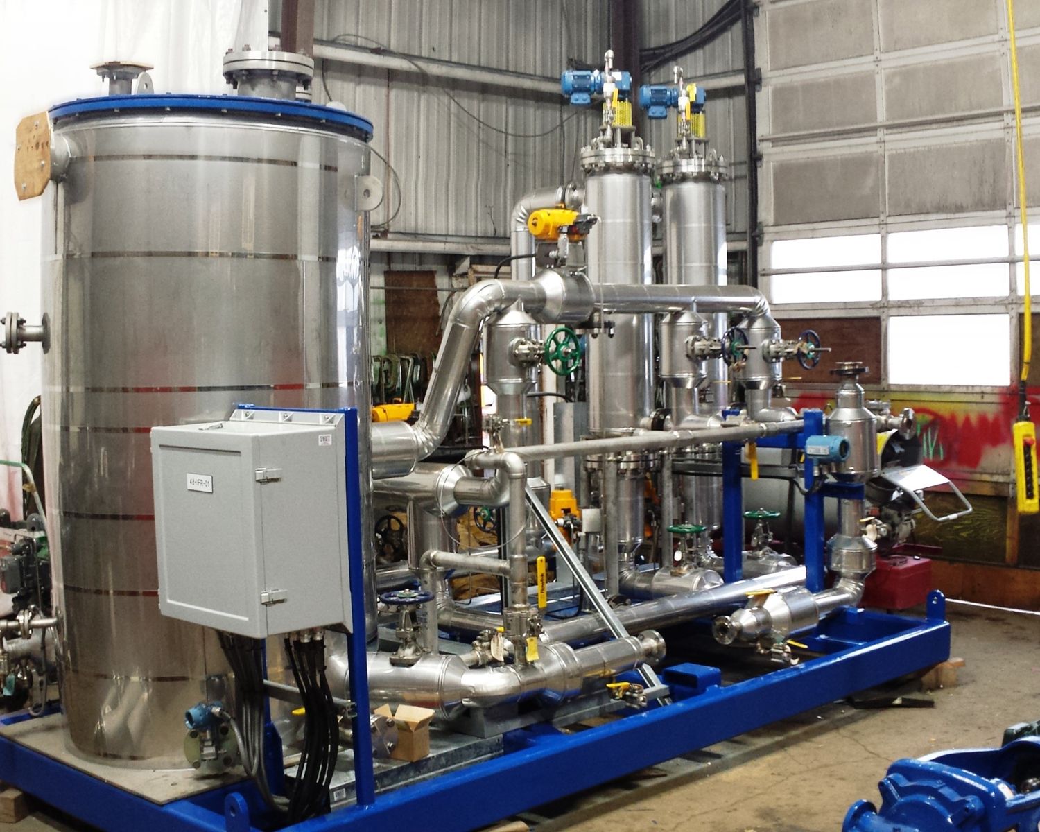 Stainless process skid with vessels and instrumentation