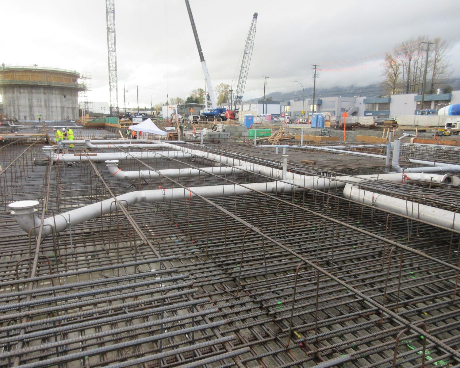 Pipe runs laid out across the slab