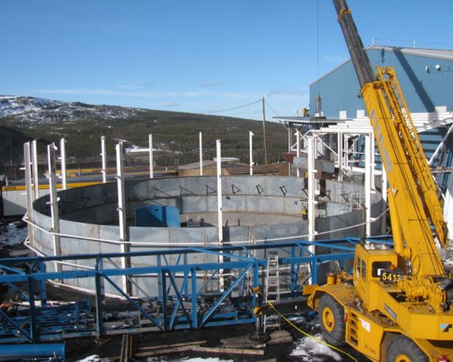 Crane installing clarifier components
